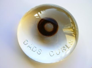 Personalised paperweight containing a lock of hair