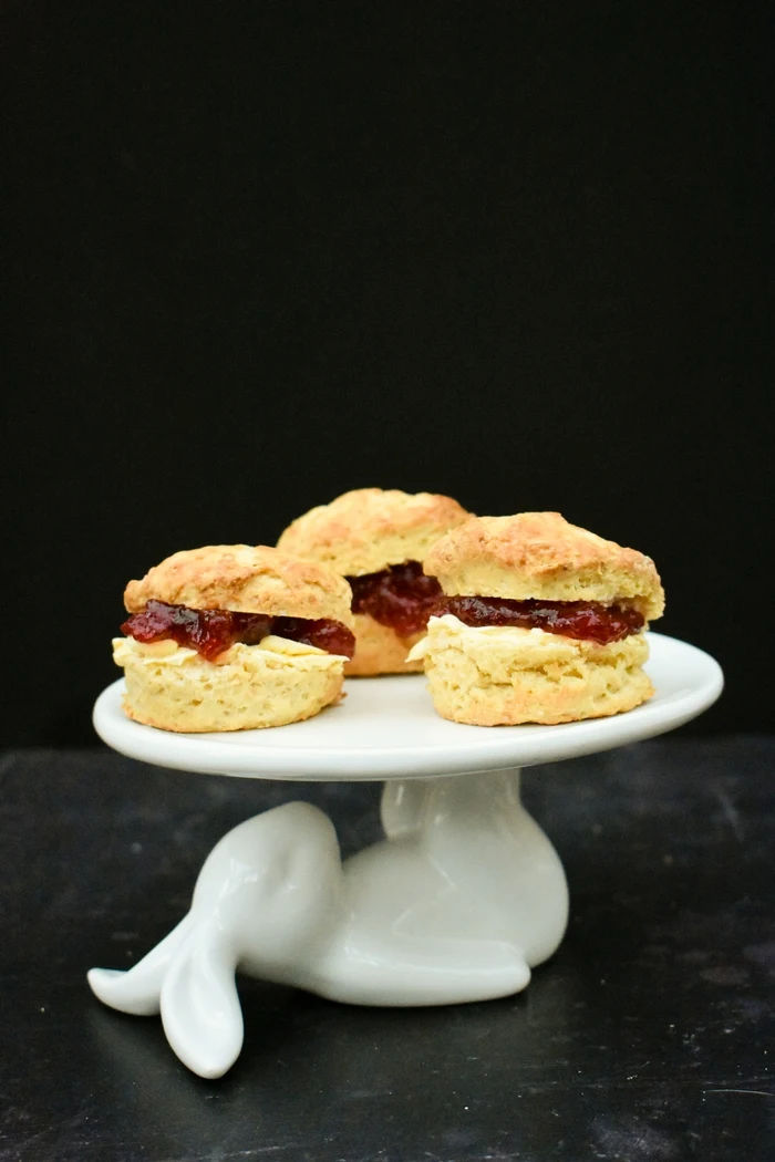 Light and fluffy Scottish scones baked to a vegan recipe and filled with dairy-free spread and jam