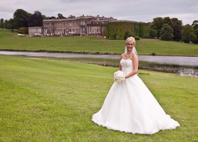 Bride with Wynyard Hall and lake in the background