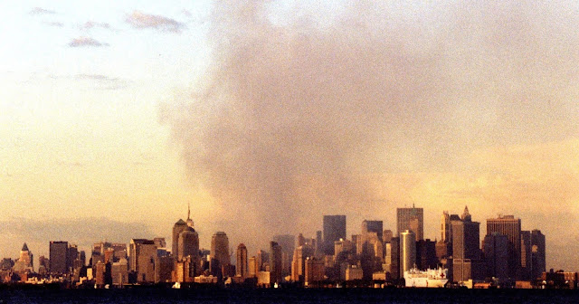 The World Trade Center burns as the USNS Comfort arrives in New York harbor September 14 at sunset. (USCG photo by PAC Brandon Brewer) https://www.dvidshub.net/search?q=1082244&view=grid