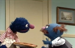 Grover and Mr Johnson Speedy Pizza. Mr Johnson orders pizza and Grover is the pizza delivery man. Sesame Street Elmo's Magic Cookbook