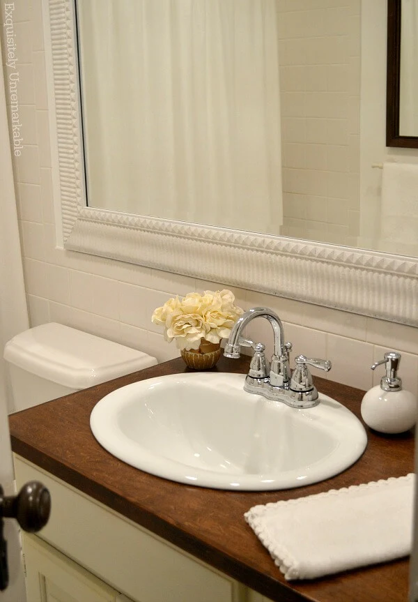 White Bathroom Decor close up of vanity and mirror