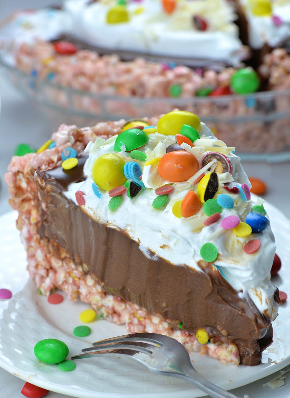 No Bake Easter Chocolate Pie - This No Bake Easter Chocolate Pie has a rice krispie crust, chocolate pie filling, and is topped with whipped cream, confetti sprinkles, M&M candies and white chocolate shavings. No Bake Easter Chocolate Pie - This No Bake Easter Chocolate Pie has a rice krispie crust, chocolate pie filling, and is topped with whipped cream, confetti sprinkles, M&M candies and white chocolate shavings.