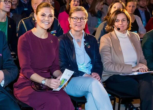 Crown Princess Victoria wore Andiata Kamille trousers and kiana blouse in burgundy, and Odnala wool coat in pink