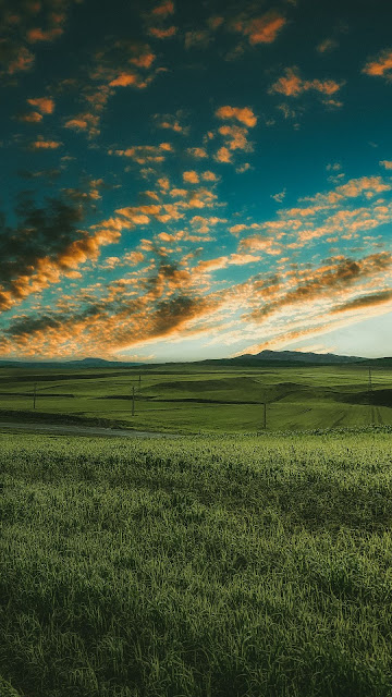 Grass field, road, clouds, sky Grass field, road, clouds, sky