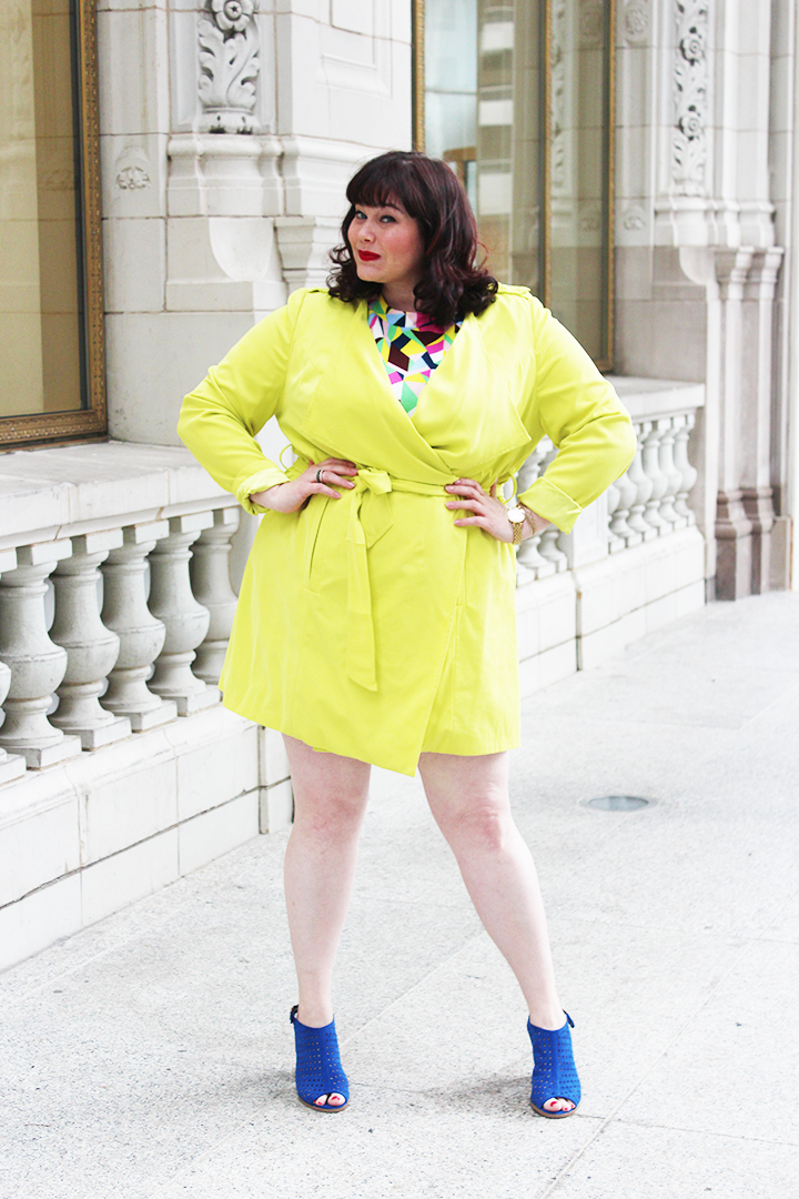 Plus Size Blogger Amber from Style Plus Curves in a Simply Be USA Colorful Abstract Dress, Bright Yellow Coat and Blue Accessories