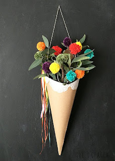 Make rainbow pom pom in a paper cone holder to freshen space for Spring Make rainbow pom pom in a paper cone holder to freshen space for Spring