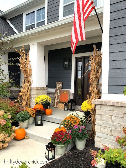 Fall front porch with mums and corn stalks