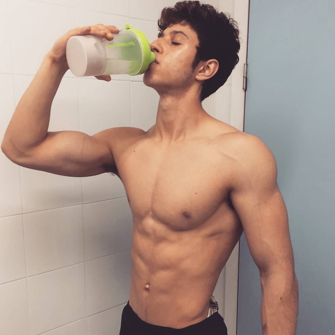 cute-young-fit-shirtless-boy-drinking-healthy
