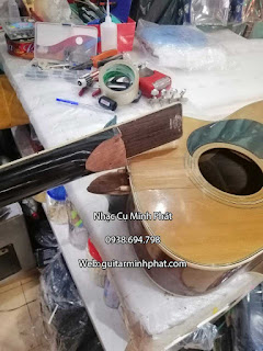 Địa chỉ thay dây đàn, chỉnh rè, dán thùng đàn guitar tphcm