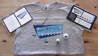 Sparkle City Mini Putt t-shirt, minigolf balls and scorecards Photo of the Sparkle City Mini Putt t-shirt, minigolf balls and scorecards