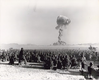 US military watching a nearby nuclear explosion in a desert