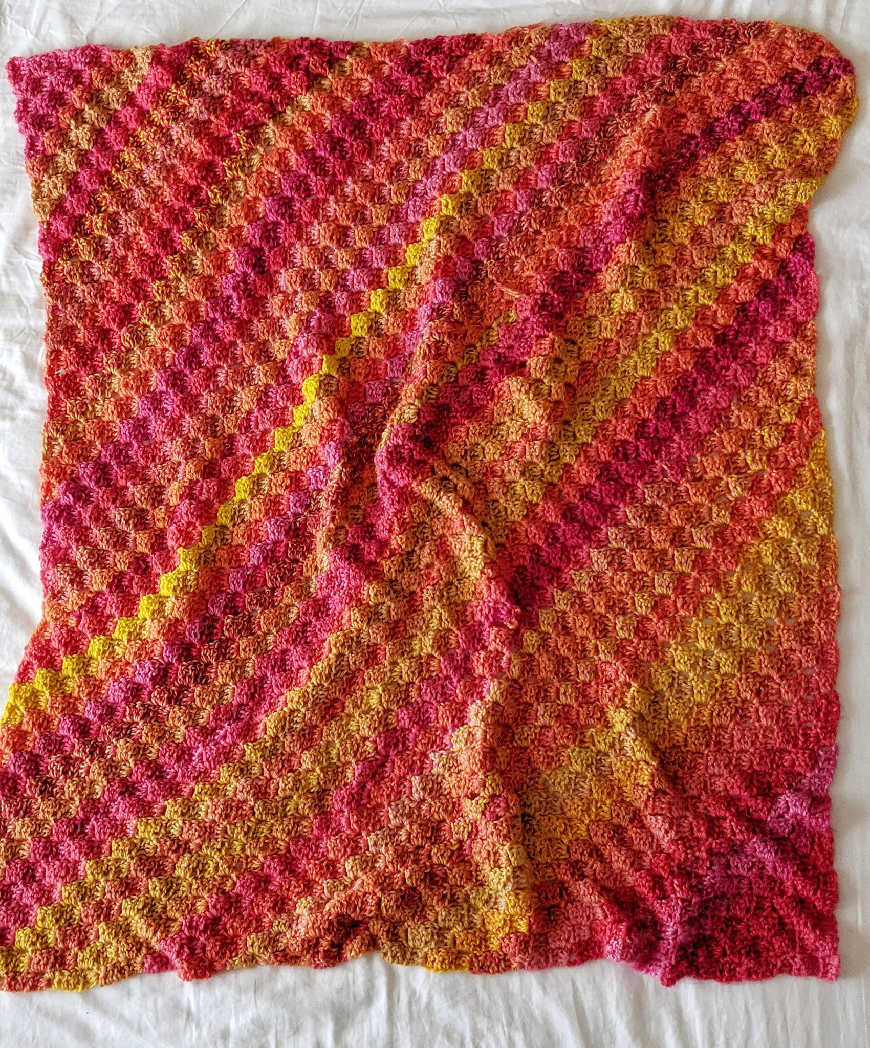 Finished my first blanket! C2C using Red Heart Neon Stripes. Still