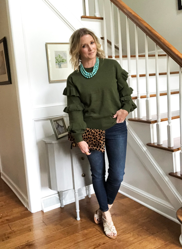 olive sweater with ruffles, skinny jeans and lace up sandals