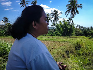 Woman Meditating In The Fresh Air And Calm Atmosphere In Fields North Bali Indonesia