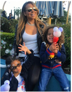 Marey carey and her kids in Disneyland 