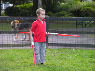 heavily armed child with double ended light sabre
