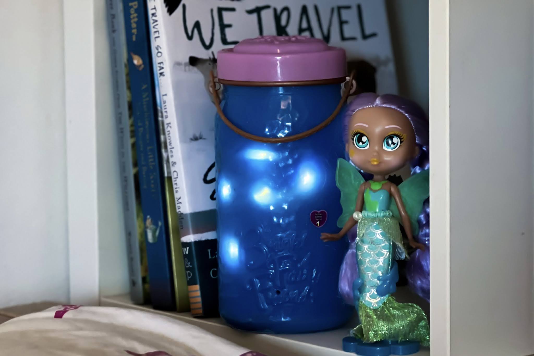 Bright Fairy Friends review showing the mermaid doll in stand and light up jar on a bookshelf