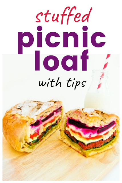 Best Summer Stuffed Picnic Loaf - A sharing sandwich perfect for families or friends at the beach or on a picnic. Includes stuffed picnic loaf tips #picnic #picnicloaf #stuffedloaf #picnicloaf #layeredsandwich #picnicsandwiches #picnicsandwich #sandwich #sandwiches #vegetariansandwich #veganssandwich