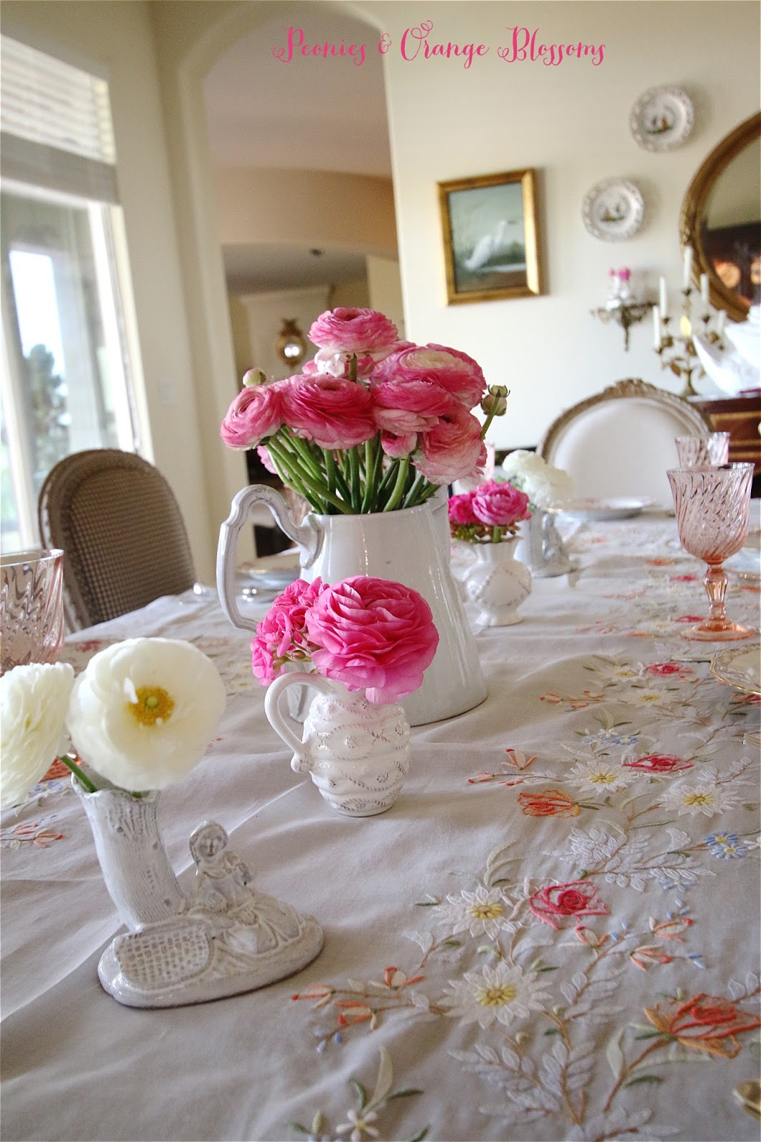 French table with fresh pink and white ranunculus