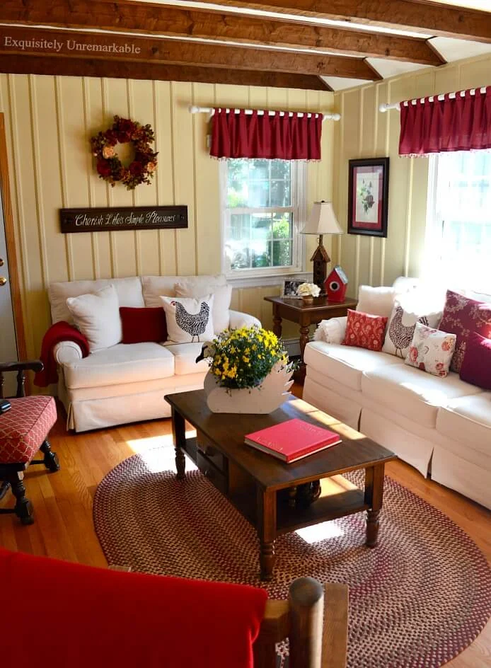 Rustic Cottage Living Room with white couches and red accents