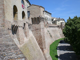 Iesi has massive 14th century walls that reflect its history as a former stronghold of the Sforza family