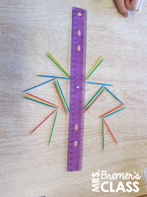 We started our fractions unit by learning about symmetry and lines of symmetry. Here's an activity that helped students learn it in a very hands-on, visual way!