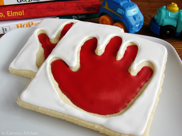 Handprint Cookies -the cookie dough is perfect for this edible gift since it doesn't spread during baking and will keep the imprint of your little one's handprint.