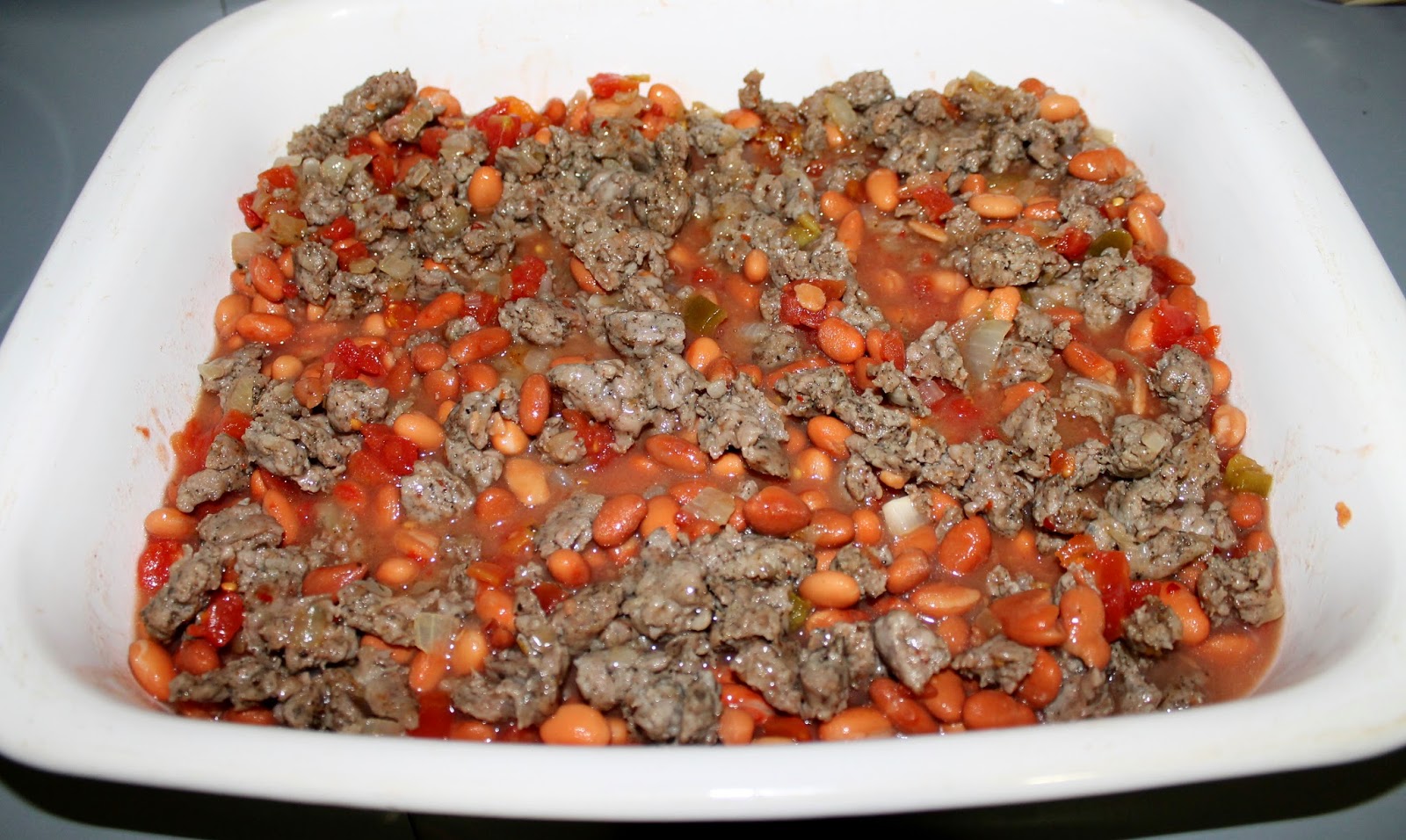 casserole pinto bean rotel onion cooked drain sausage until together brown through beans