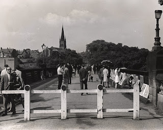 A temporary wooden gate blocks traffic on Armstrong Bridge