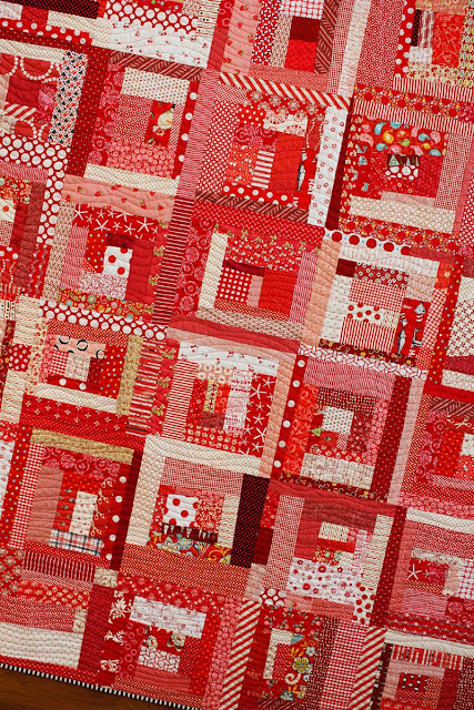 Wonky log cabin quilt in all red - there's a tutorial to make these blocks!