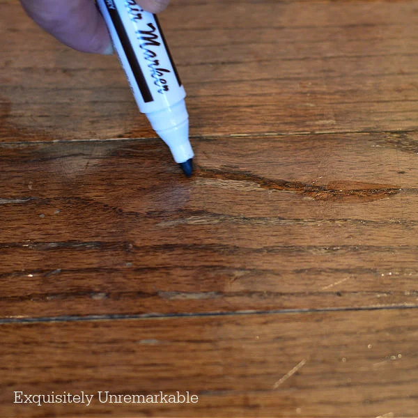 Fixing A Damaged Wood Floor With A Furniture Marker
