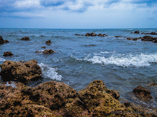 Sea Water Waves Between Chunks Of Coral Reefs By The Beach At Umeanyar Village, North Bali, Indonesia