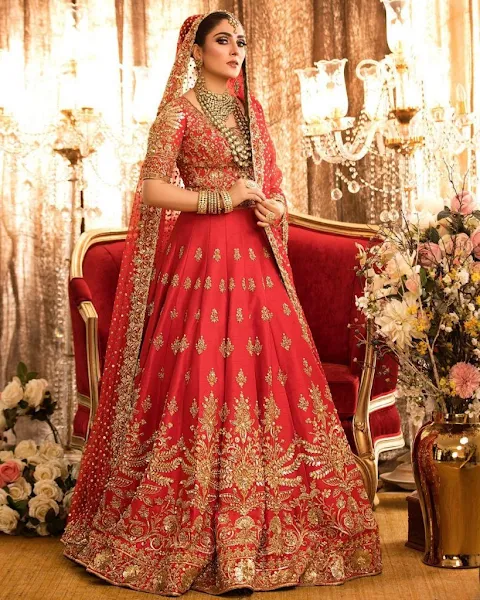 Ayeza Khan looks stunning in dazzling traditional deep red bridal gown by Nomi Ansari