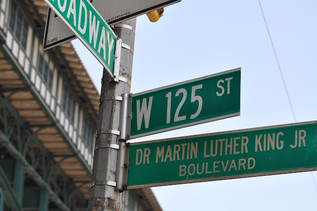 Street signs for W 125 st.