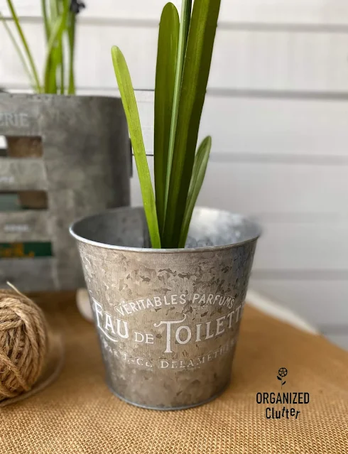 Photo of small galvanized pot with faux plant