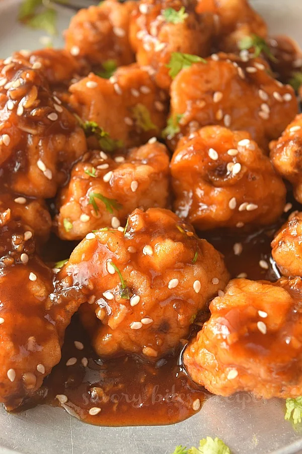 close look of general tsos cauloflower served on a plate