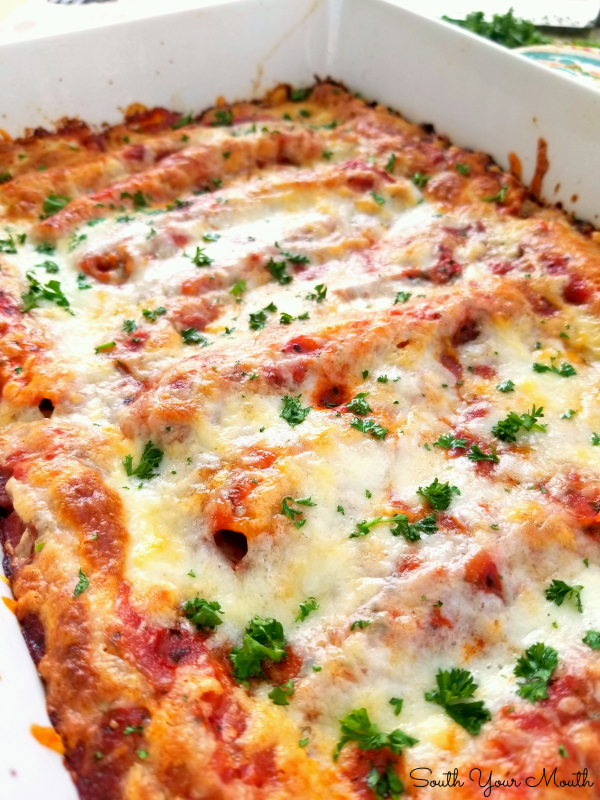 Italian Sausage & Cheese Baked Manicotti! An easy recipe for classic, meaty baked manicotti stuffed with Italian sausage and cheese.