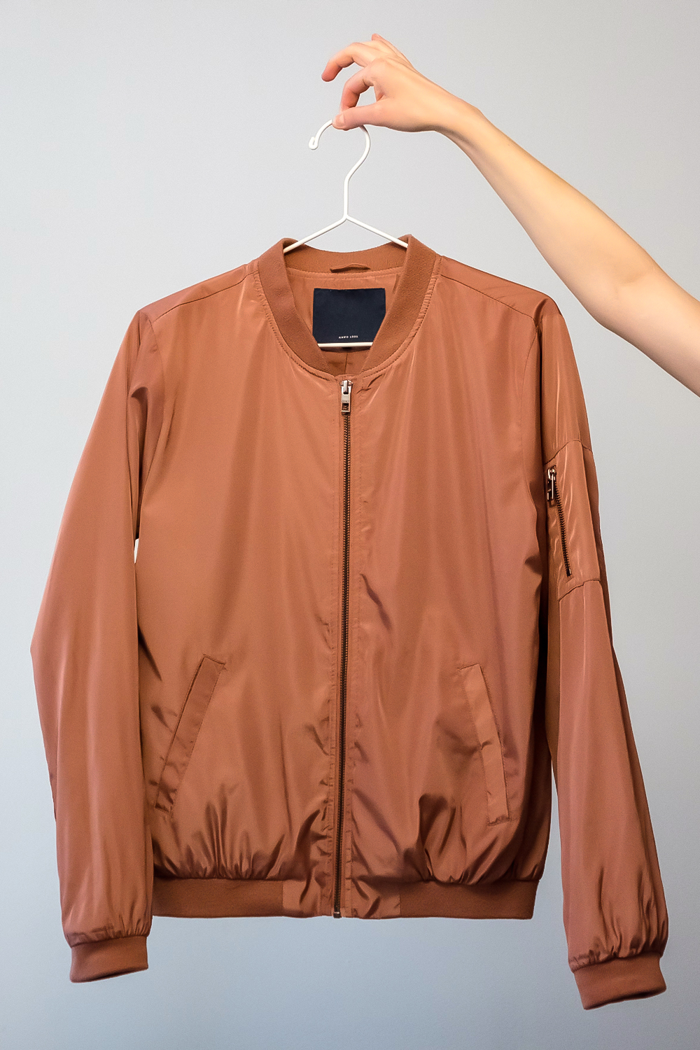 bomber jacket on clothing hanger