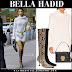 Bella Hadid in white turtleneck dress and snakeskin knee boots in NYC on November 3