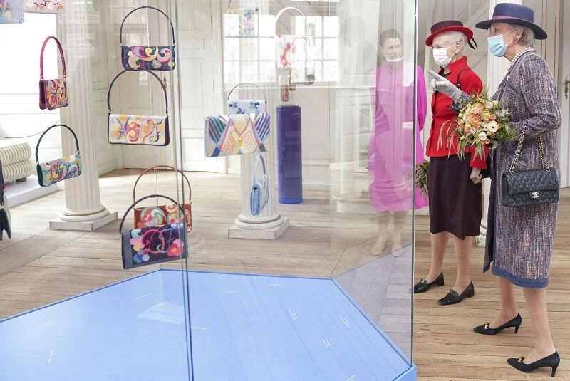 Queen Margrethe and Princess Benedikte visited the Queen's Embroideries exhibition. Red blazer and printed wool coat