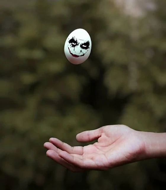 joker face with egg emoji