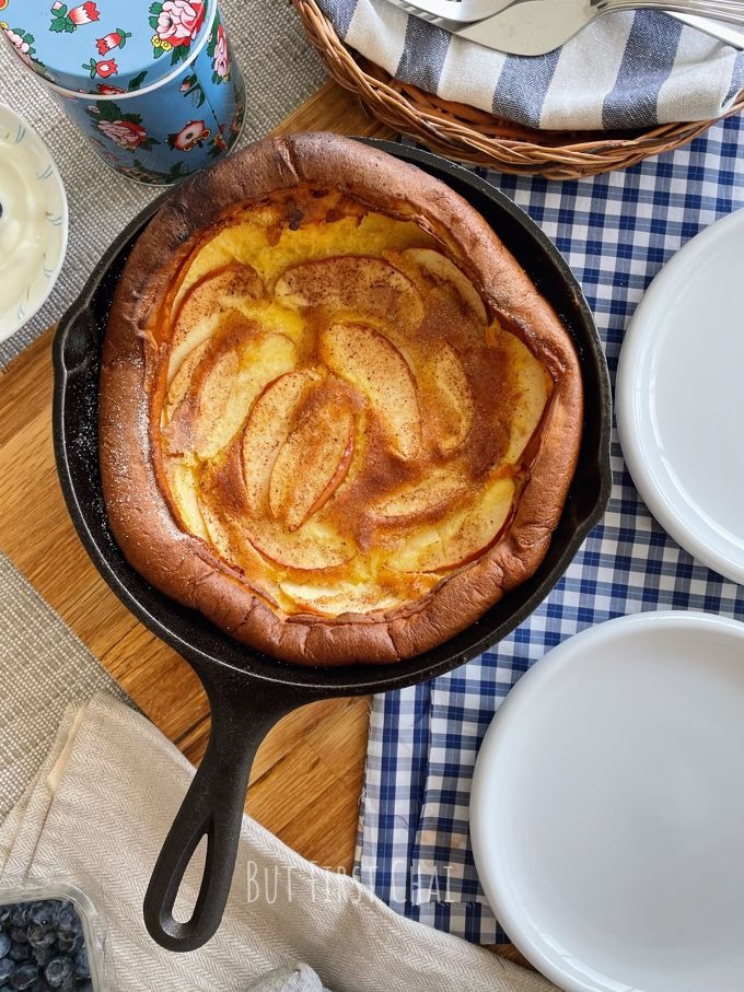 Dutch baby with apples in a cast-iron skillet