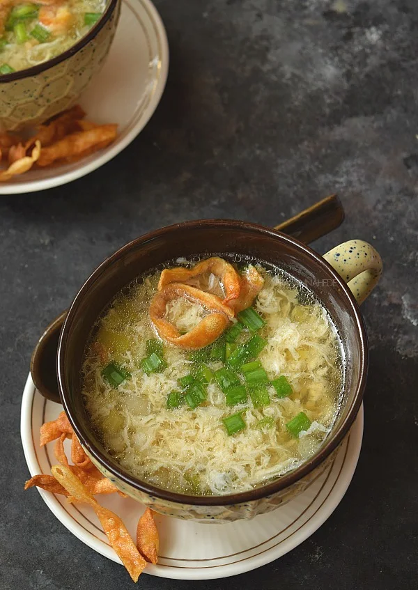 a bowl with comforting cozy egg drop soup