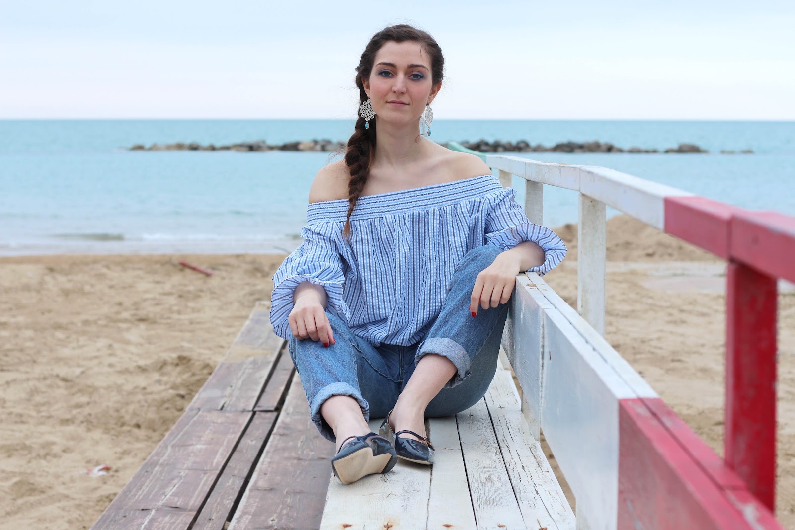 fashion style blogger outfit ootd italian girl italy vogue glamour pescara light blue bow off-the-shoulder top bluse chicwish trend denim jeans 90 calends blue bag borsa blu prospering flats ballerine shoes scarpe fabijoux earrings orecchini macramè braid hairstyle hair