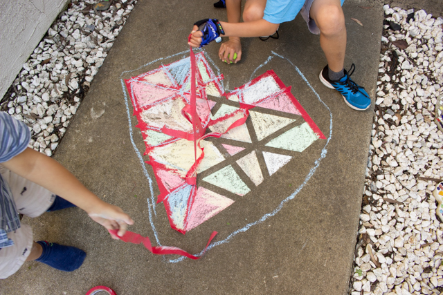 tape resist chalk hearts- easy art project to do with kids outside