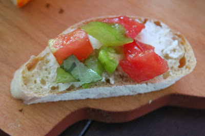 Slice of vegetable demi-baguette with goat cheese and tomatoes