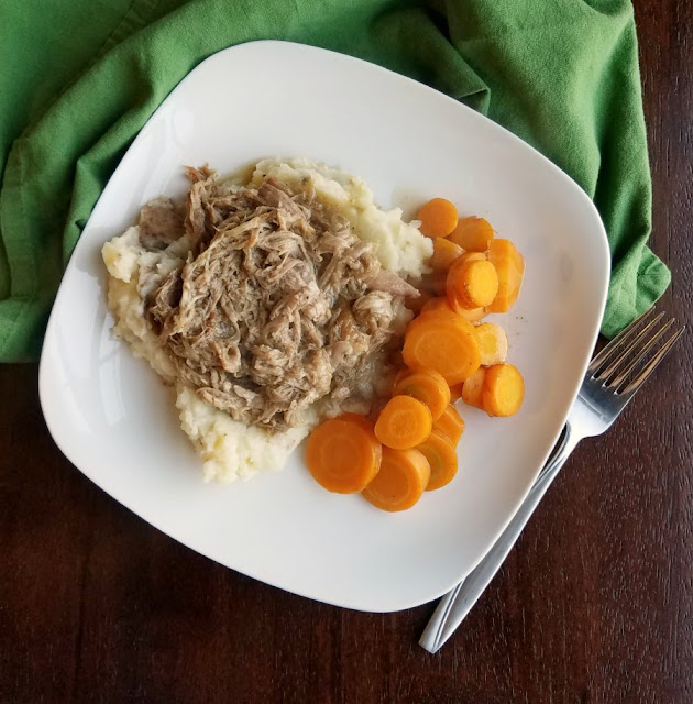 dinner plate with apple cider pulled pork, mashed potatoes and sliced carrots dinner plate with apple cider pulled pork, mashed potatoes and sliced carrots