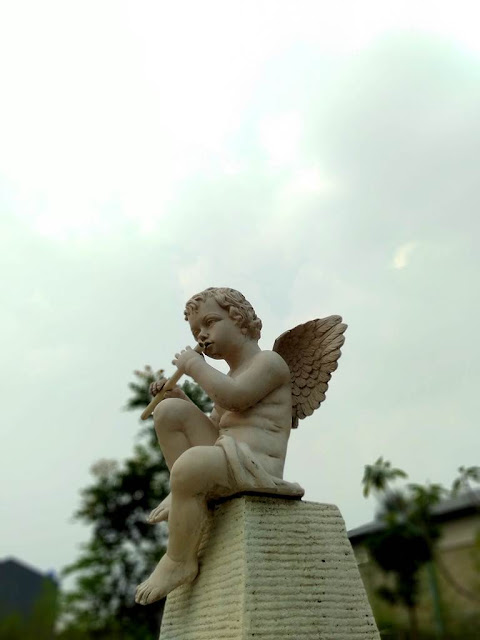 A Little Angel Playing Flute Statue - Bogor