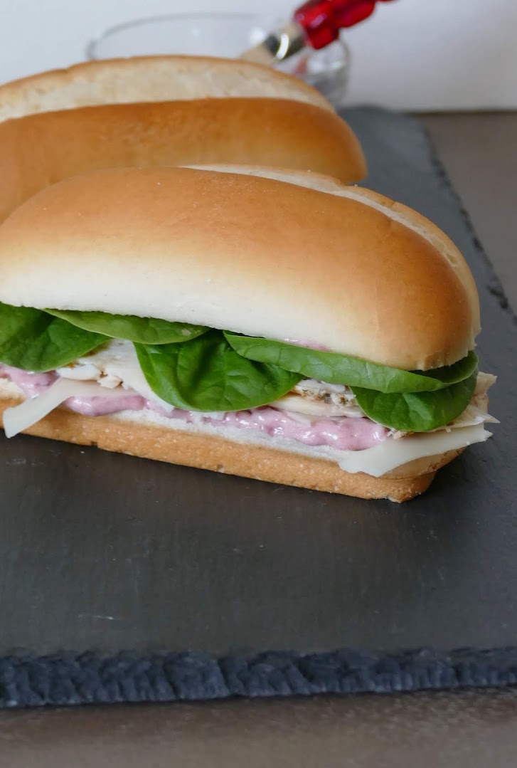 Use your leftover Thanksgiving or Christmas turkey, or deli turkey in this delicious sandwich! It's simple to make and tastes great with the cranberry mayo, spinach, turkey and swiss cheese! Make it for lunch or serve at your next game day party.